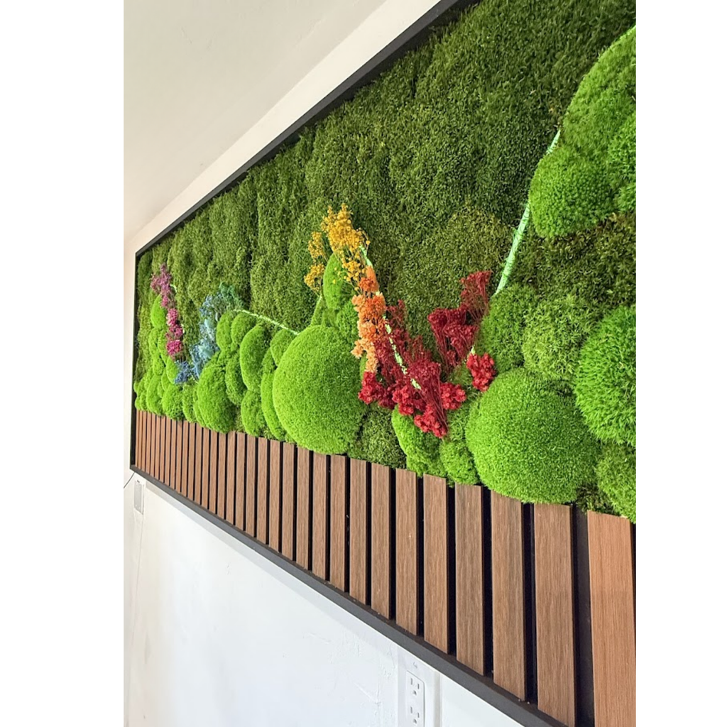 Close-up side view of preserved moss wall art with ball moss, botanical accents, and wood slat frame